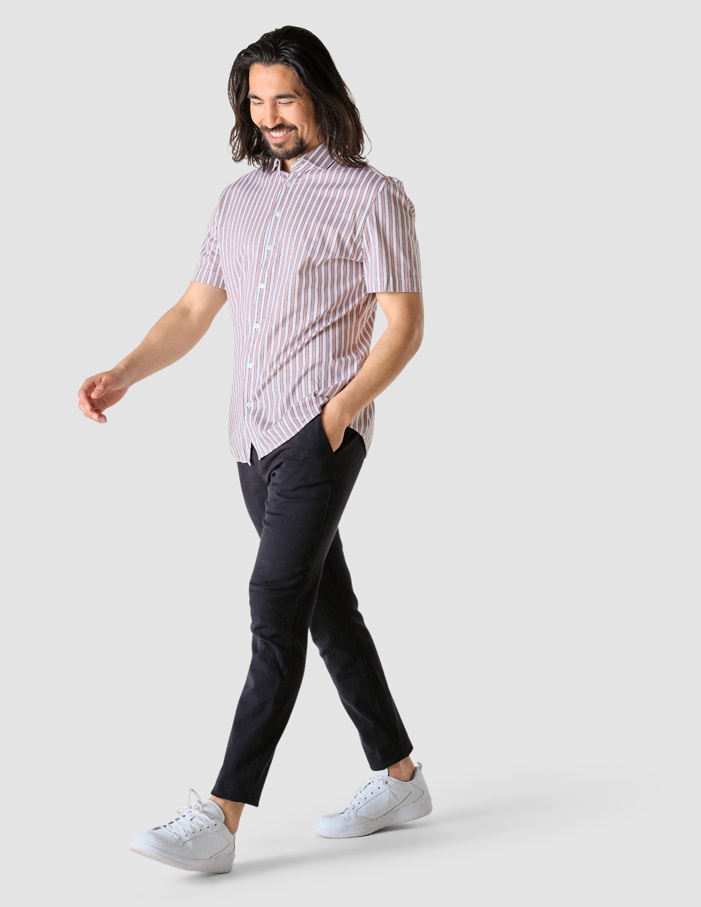 Model in full body wearing a Classic Short-Sleeved Twill Shirt Mahogany Stripes the shirt is White a subtle twill pattern and light bordeaux stripes